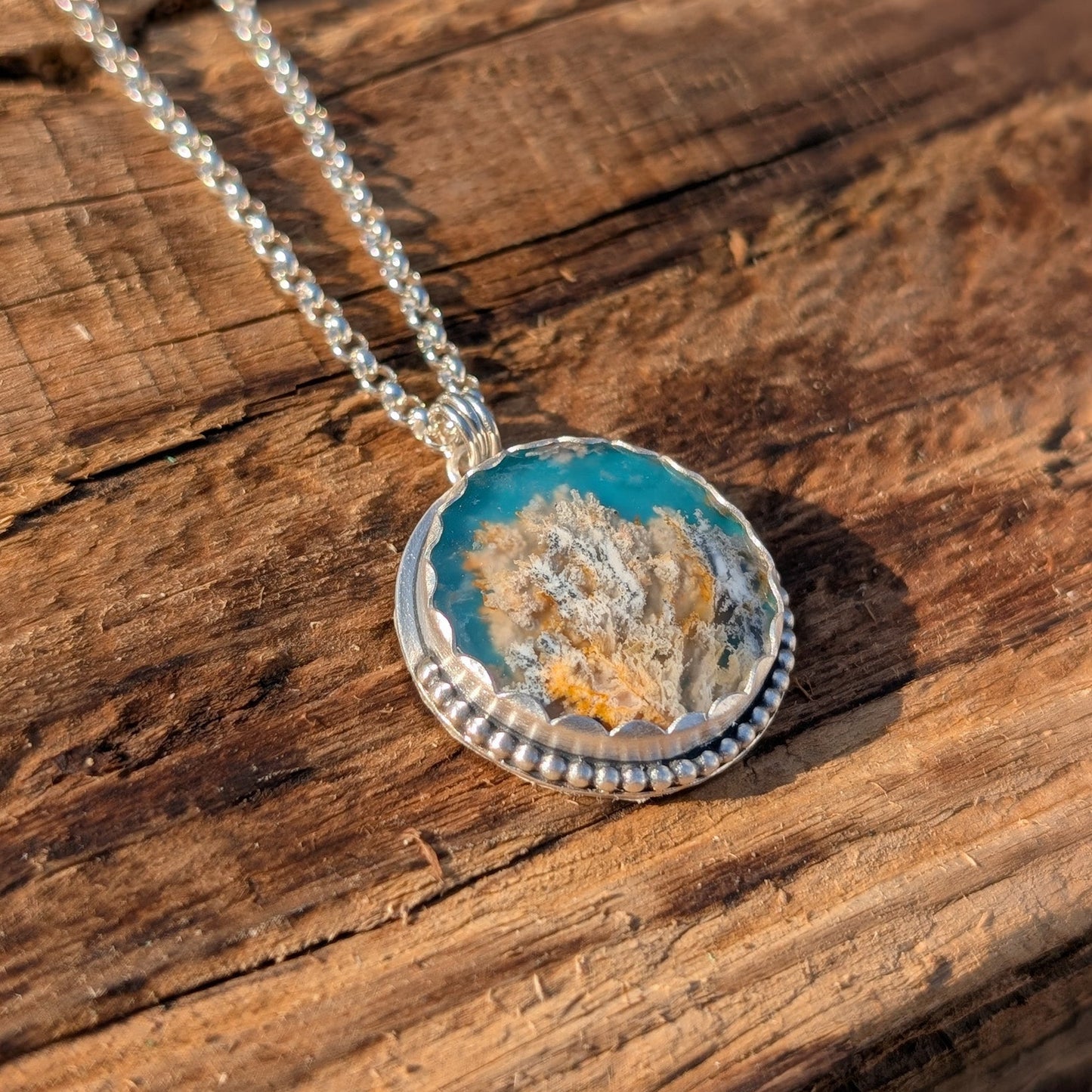 Colgante de plata con ágata pluma