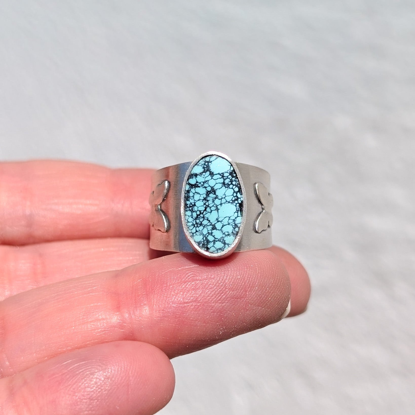 Anillo de plata con mariposas y Turquesa